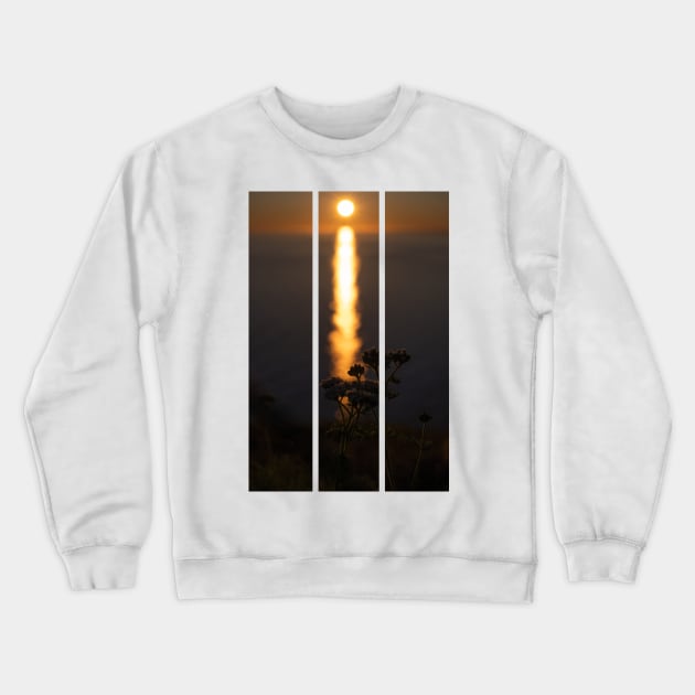 Wonderful landscapes in Norway. Nord-Norge. Beautiful scenery of a midnight sun sunset at Nordkapp (Cape North). Boat and globe on a cliff. Rippled sea and clear orange sky. (vertical) Crewneck Sweatshirt by fabbroni-art